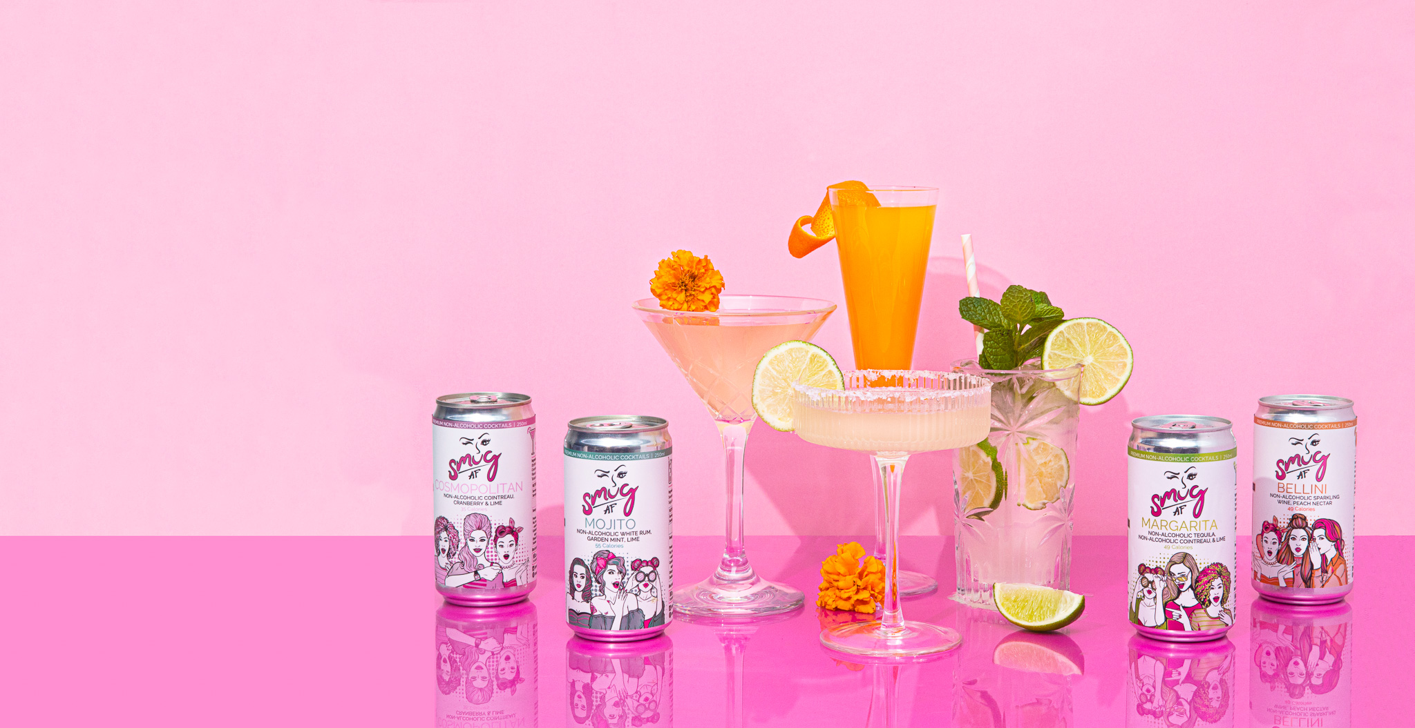 Smug AF Cocktails aranged in a nice shot on a pink background. Virgin Margarita, Bellini, Mojito and Cosmo